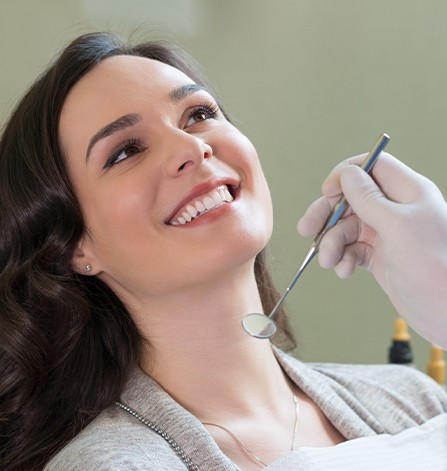 Woman receiving dental exam