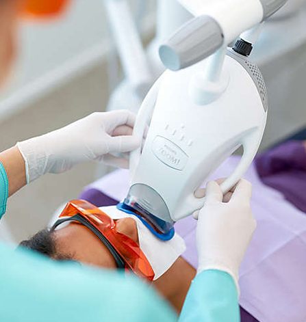 Patient receiving zoom teeth whitening treatment