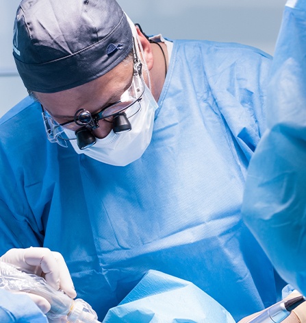 Dentist performing dental implant placement