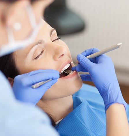 Relaxed woman receiving dental treatment