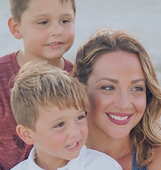 Smiling mother and two children